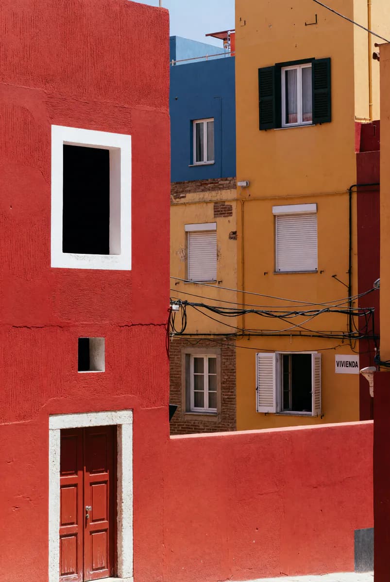Bold cinematic street scene, saturated color, sharp graphic lighting