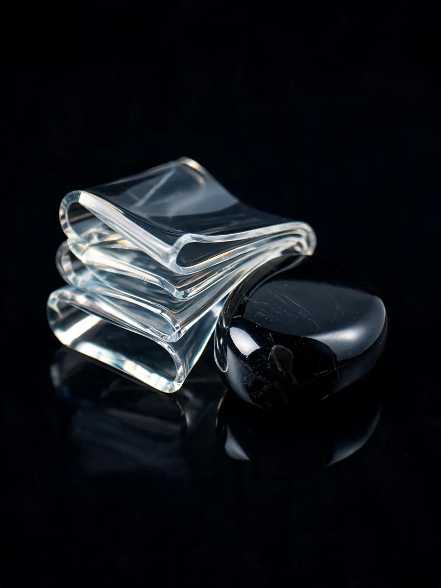 Surreal macro material study, translucent resin and brushed steel